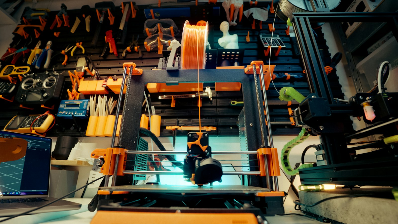 3D printer running in a maker workshop