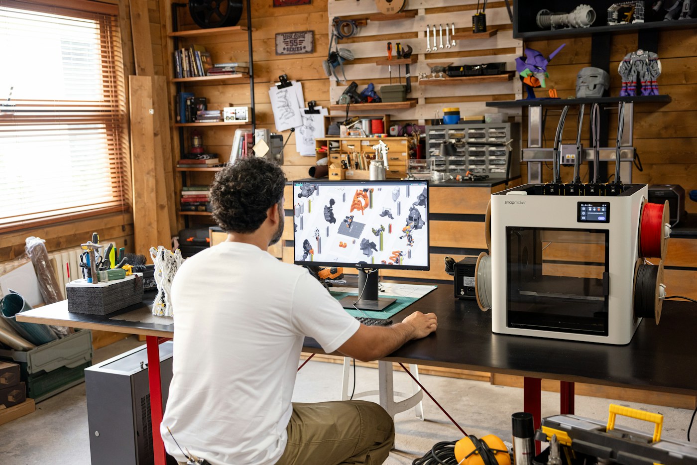 Maker reviewing a 3D print